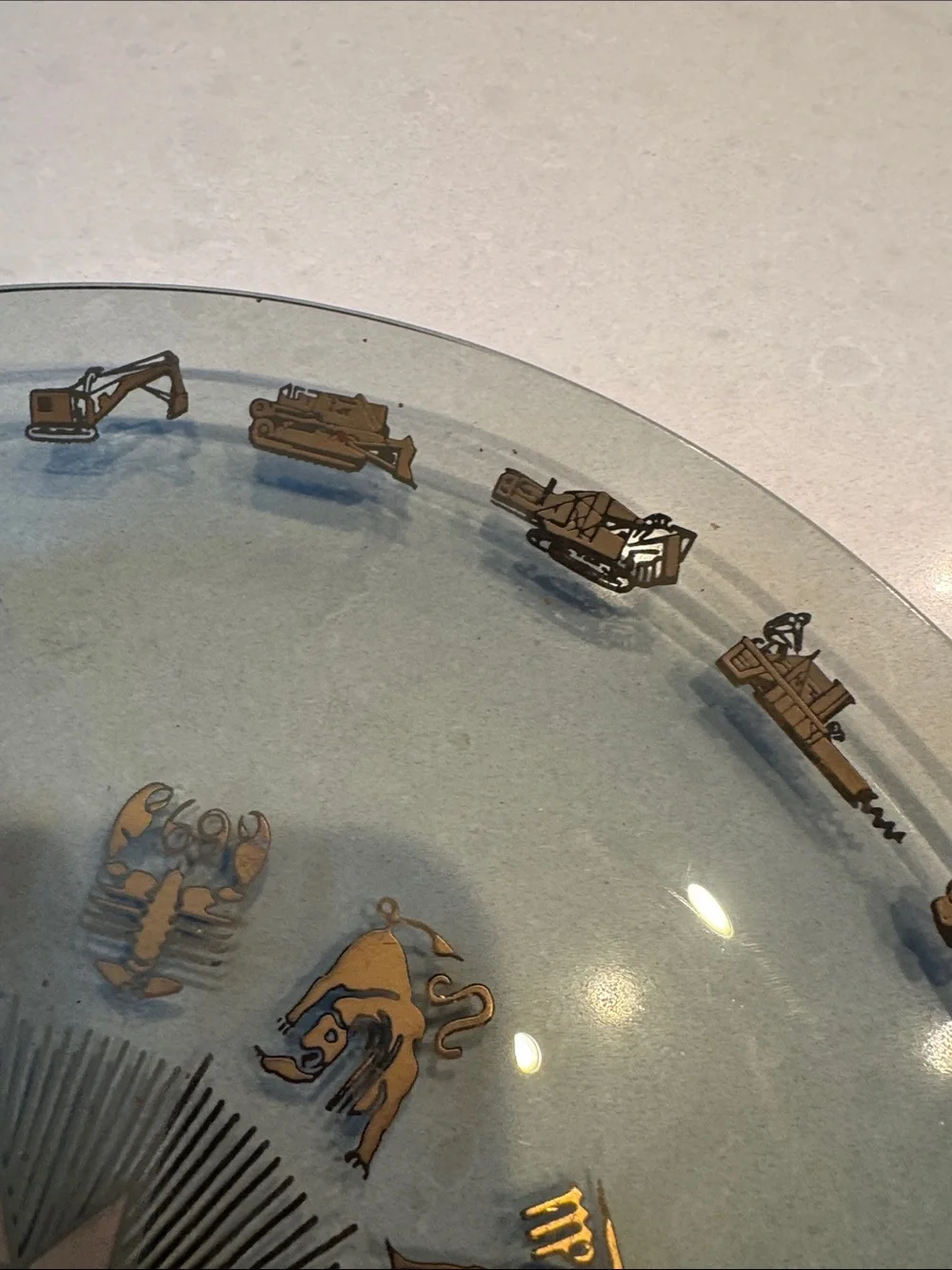 Glass Decorative Plate with Gold Zodiac Accents and heavy equipment